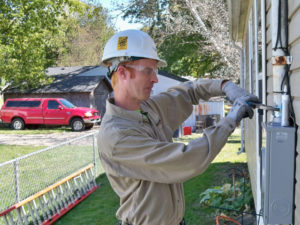 Converse Electric technician working on a residential electric box