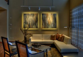 Artwork well lite on living room wall