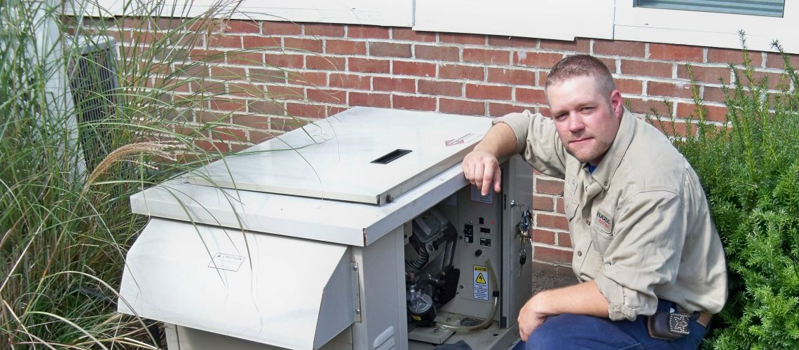 Converse Electric technician working on residential generator