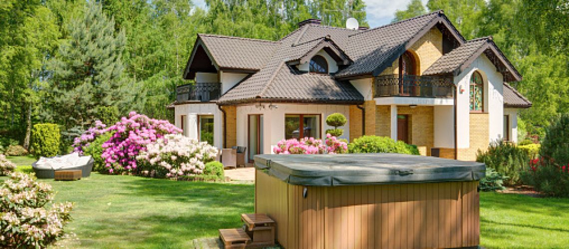 Covered hot tub in backyard