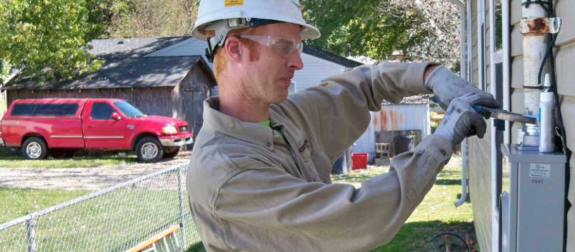 Converse Electric technician working on a residential electric box